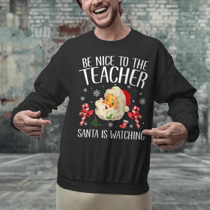 Be Nice To The Teacher Santa Is Watching School Christmas Unisex Sweatshirt, gift for family, gift for coworker Be Nice To The Teacher Santa Is Watching School Christmas Unisex Sweatshirt, gift for family, gift for coworker