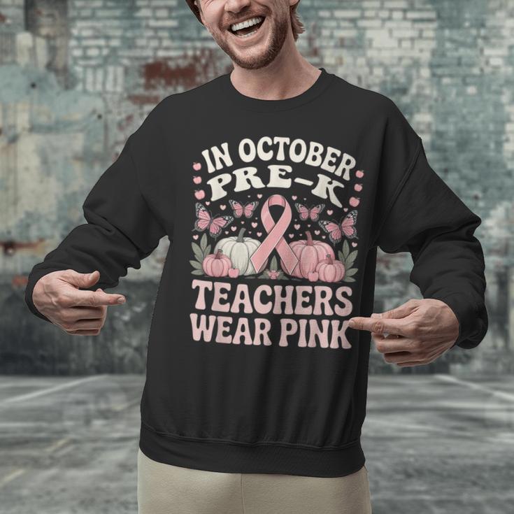 In October Pre-K Teachers Wear Pink Ribbon Breast Cancer Unisex Sweatshirt, gift for family, gift for coworker In October Pre-K Teachers Wear Pink Ribbon Breast Cancer Unisex Sweatshirt, gift for family, gift for coworker