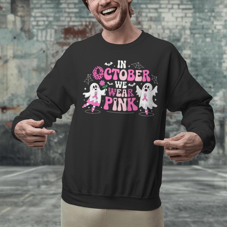 In October We Wear Pink Ballet Ghost Teacher Breast Cancer Unisex Sweatshirt, gift for family, gift for coworker