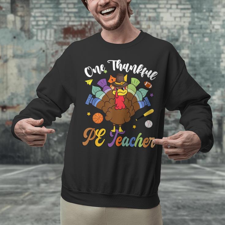 One Thankful PE Teacher Turkey Thanksgiving -Adults & Kids Classic Fit Polyester 100 Short Sleeve Unisex Sweatshirt, Pe Teacher Sweatshirts, gift for family, gift for coworker One Thankful PE Teacher Turkey Thanksgiving -Adults & Kids Classic Fit Polyester 100 Short Sleeve Unisex Sweatshirt, Pe Teacher Sweatshirts, gift for family, gift for coworker