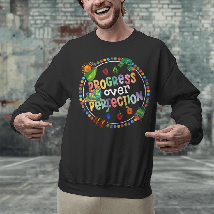 Progress Over Perfection Caterpillar Back To School Teacher Unisex Sweatshirt, gift for family, gift for coworker Progress Over Perfection Caterpillar Back To School Teacher Unisex Sweatshirt, gift for family, gift for coworker