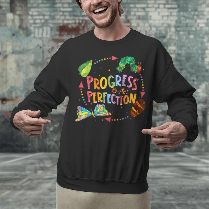 Progress Over Perfection Caterpillar Teacher Back To School Unisex Sweatshirt, gift for family, gift for coworker Progress Over Perfection Caterpillar Teacher Back To School Unisex Sweatshirt, gift for family, gift for coworker