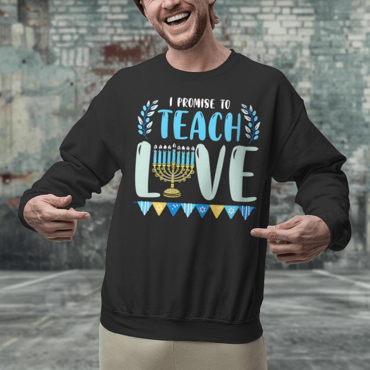 I Promise To Teach Love Hanukkah Chanukah Jewish Teacher Unisex Sweatshirt, gift for family, gift for coworker I Promise To Teach Love Hanukkah Chanukah Jewish Teacher Unisex Sweatshirt, gift for family, gift for coworker