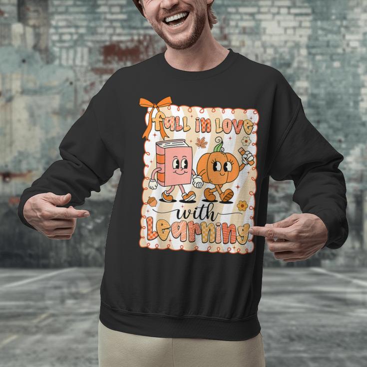 Pumpkin Teacher Preppy Fall In Love With Learning Autumn Unisex Sweatshirt, gift for family, gift for coworker Pumpkin Teacher Preppy Fall In Love With Learning Autumn Unisex Sweatshirt, gift for family, gift for coworker