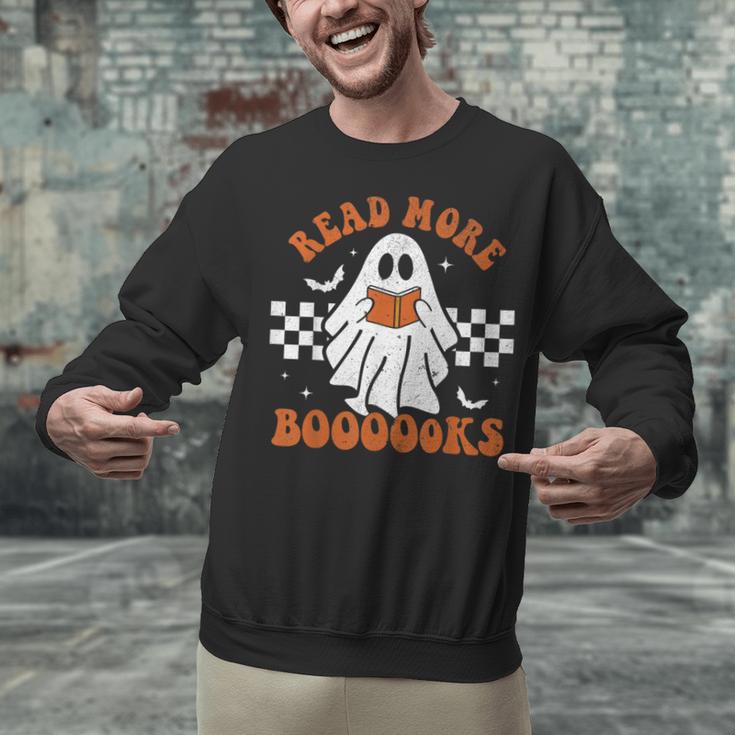 Read More Books Cute Ghost Reading Book Teacher Halloween Unisex Sweatshirt, gift for family, gift for coworker Read More Books Cute Ghost Reading Book Teacher Halloween Unisex Sweatshirt, gift for family, gift for coworker