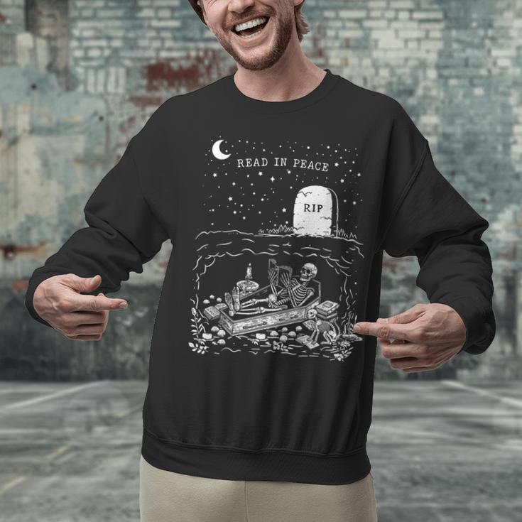 Read In Peace Skeleton Halloween Book Reading Spooky Teacher Unisex Sweatshirt, gift for family, gift for coworker Read In Peace Skeleton Halloween Book Reading Spooky Teacher Unisex Sweatshirt, gift for family, gift for coworker