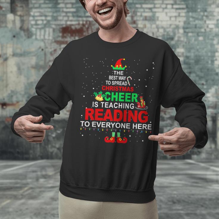 Reading Teacher Christmas Shirt Elf Christmas Cheer For Men Women Unisex Sweatshirt, gift for family, gift for coworker Reading Teacher Christmas Shirt Elf Christmas Cheer For Men Women Unisex Sweatshirt, gift for family, gift for coworker