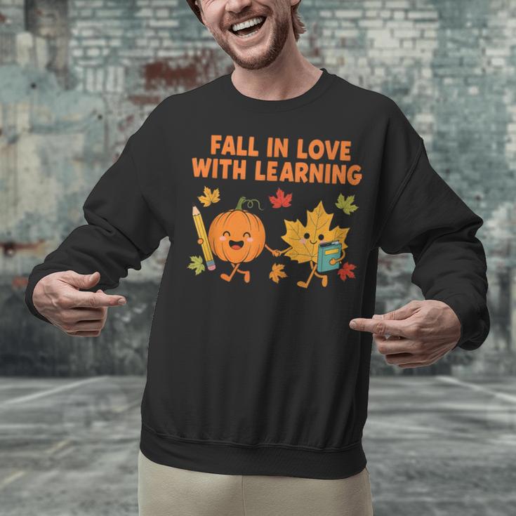 Retro Fall In Love With Learning Autumn Pumpkin Teacher Unisex Sweatshirt, gift for family, gift for coworker Retro Fall In Love With Learning Autumn Pumpkin Teacher Unisex Sweatshirt, gift for family, gift for coworker