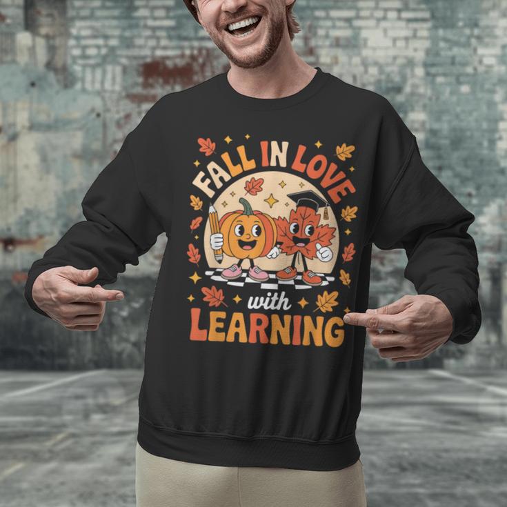 Retro Fall In Love With Learning Pumpkin Leaf Teacher Autumn Unisex Sweatshirt, gift for family, gift for coworker Retro Fall In Love With Learning Pumpkin Leaf Teacher Autumn Unisex Sweatshirt, gift for family, gift for coworker