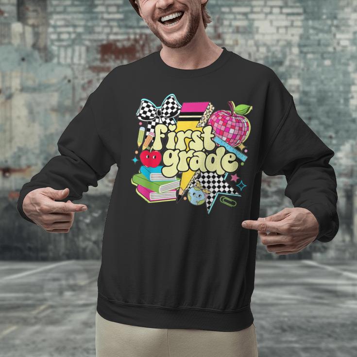 Retro First Grade Teacher Disco Ball Coquette Back To School Unisex Sweatshirt, First Grade Teacher Sweatshirts, gift for family, gift for coworker Retro First Grade Teacher Disco Ball Coquette Back To School Unisex Sweatshirt, First Grade Teacher Sweatshirts, gift for family, gift for coworker