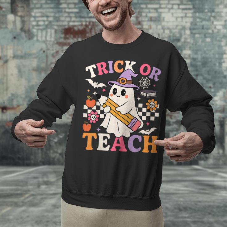 Retro Floral Ghost Trick Or Teach Groovy Teacher Halloween Unisex Sweatshirt, Groovy Teacher Sweatshirts, gift for family, gift for coworker