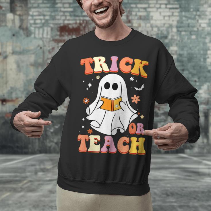 Retro Vintage Groovy Trick Or Teach Teacher Halloween For Men Women Kids Unisex Sweatshirt, Groovy Teacher Sweatshirts, gift for family, gift for coworker