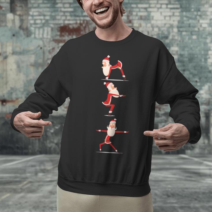 Santa Yoga Poses For Yogi Teacher Christmas Yoga Poses Unisex Sweatshirt, gift for family, gift for coworker Santa Yoga Poses For Yogi Teacher Christmas Yoga Poses Unisex Sweatshirt, gift for family, gift for coworker