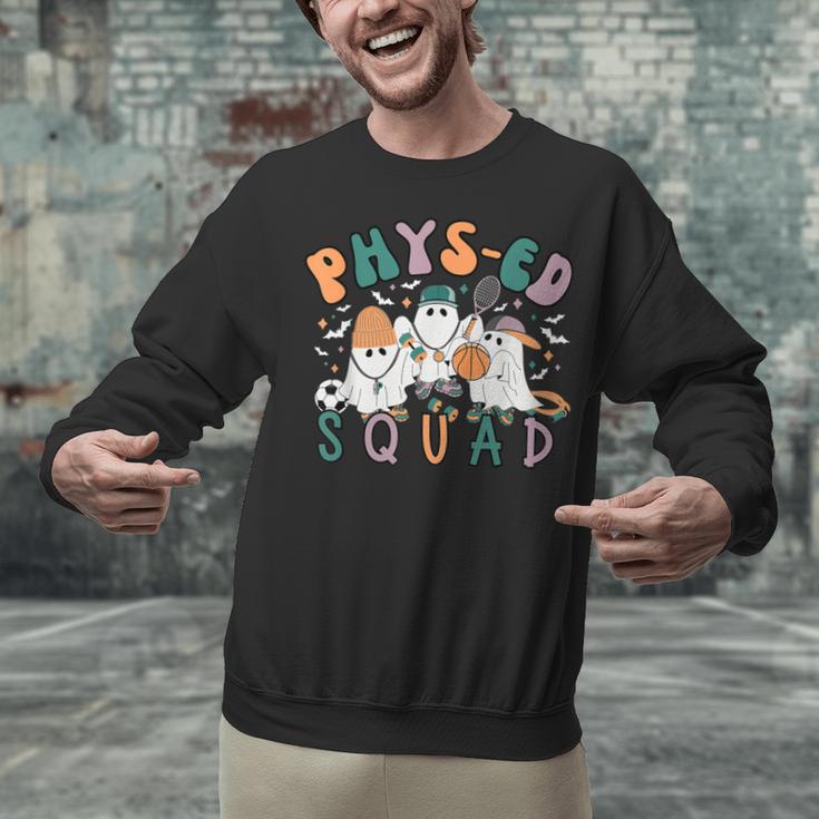 Spooky Ghost PE Teacher Squad Physical Education Halloween Unisex Sweatshirt, Pe Teacher Sweatshirts, gift for family, gift for coworker Spooky Ghost PE Teacher Squad Physical Education Halloween Unisex Sweatshirt, Pe Teacher Sweatshirts, gift for family, gift for coworker