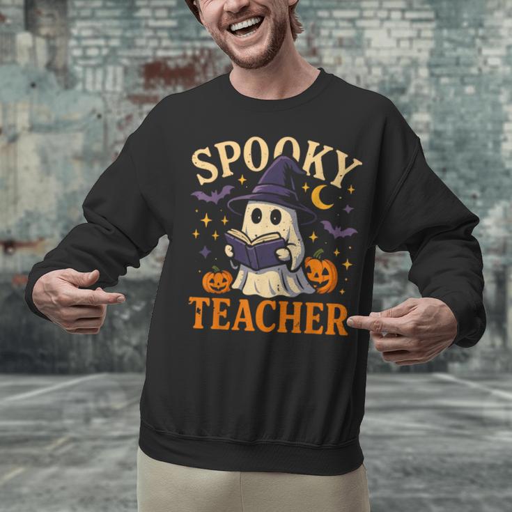 Spooky Teacher Halloween Cute Ghost Pumpkin Reading Women Unisex Sweatshirt, gift for family, gift for coworker Spooky Teacher Halloween Cute Ghost Pumpkin Reading Women Unisex Sweatshirt, gift for family, gift for coworker