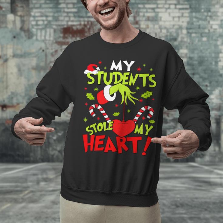 My Students Stole My Heart Teacher Holiday Merry Christmas Unisex Sweatshirt, gift for family, gift for coworker My Students Stole My Heart Teacher Holiday Merry Christmas Unisex Sweatshirt, gift for family, gift for coworker