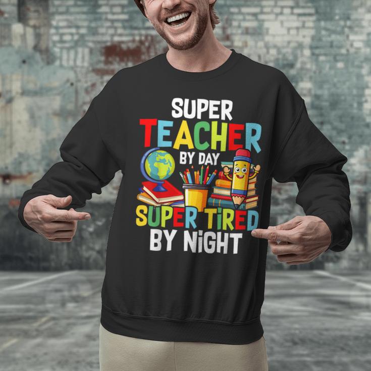 Super Teacher By Day Super Tired By Night Unisex Sweatshirt, Super Teacher Sweatshirts, gift for family, gift for coworker Super Teacher By Day Super Tired By Night Unisex Sweatshirt, Super Teacher Sweatshirts, gift for family, gift for coworker