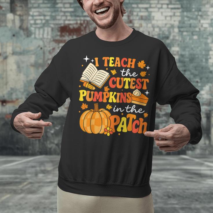I Teach The Coolest Pumpkins In The Patch Teacher Halloween Unisex Sweatshirt, gift for family, gift for coworker I Teach The Coolest Pumpkins In The Patch Teacher Halloween Unisex Sweatshirt, gift for family, gift for coworker