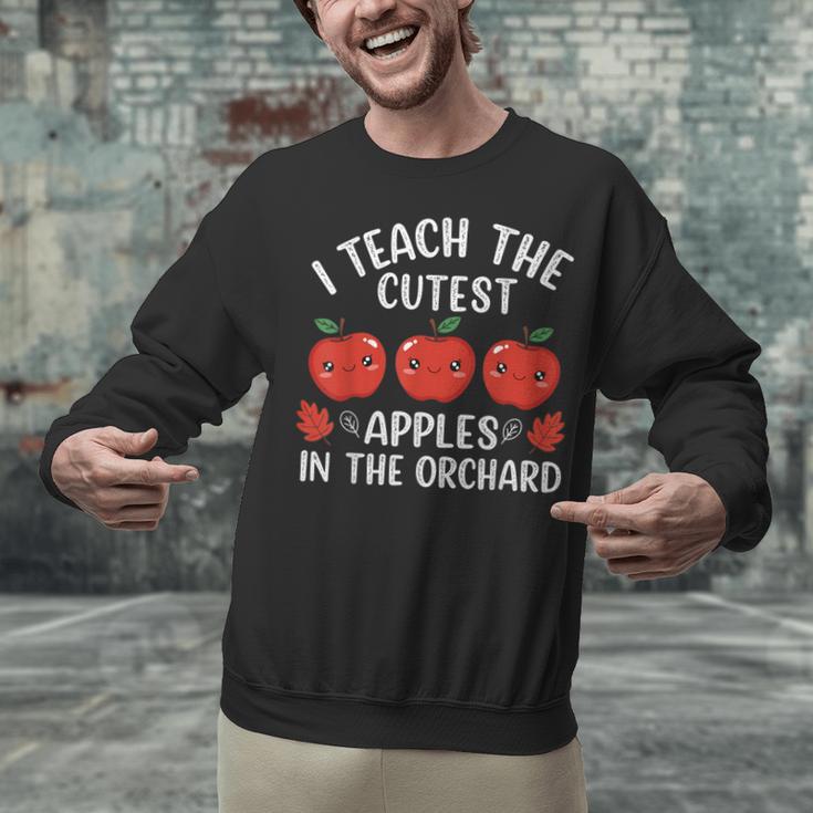 I Teach The Cutest Apples In The Orchard Cute Fall Teacher Unisex Sweatshirt, gift for family, gift for coworker I Teach The Cutest Apples In The Orchard Cute Fall Teacher Unisex Sweatshirt, gift for family, gift for coworker