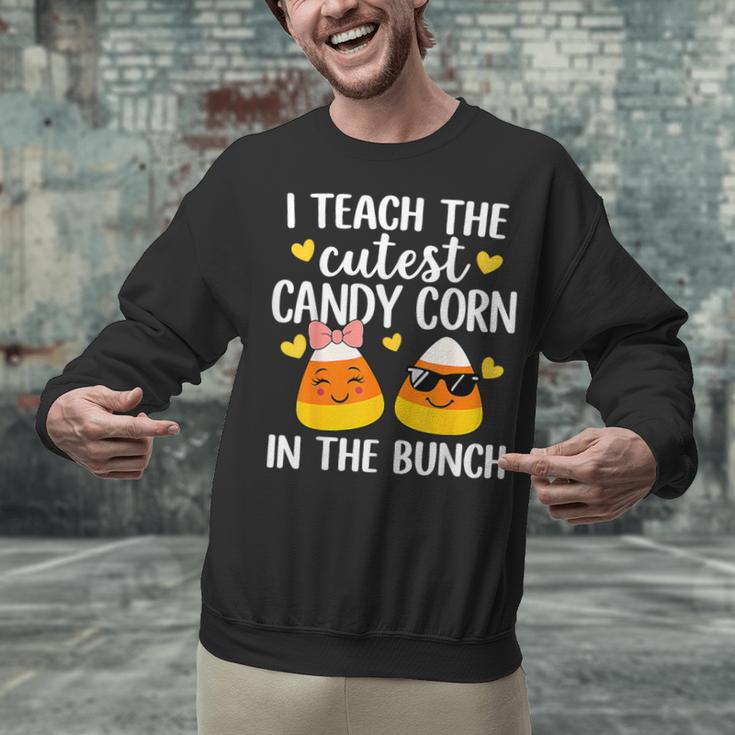 I Teach The Cutest Candy Corn In The Bunch Teacher Halloween Unisex Sweatshirt, gift for family, gift for coworker