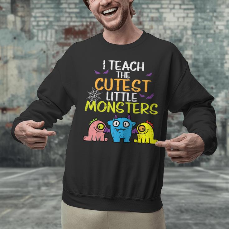 I Teach Cutest Little Monsters Halloween Teacher Men Women Unisex Sweatshirt, gift for family, gift for coworker I Teach Cutest Little Monsters Halloween Teacher Men Women Unisex Sweatshirt, gift for family, gift for coworker