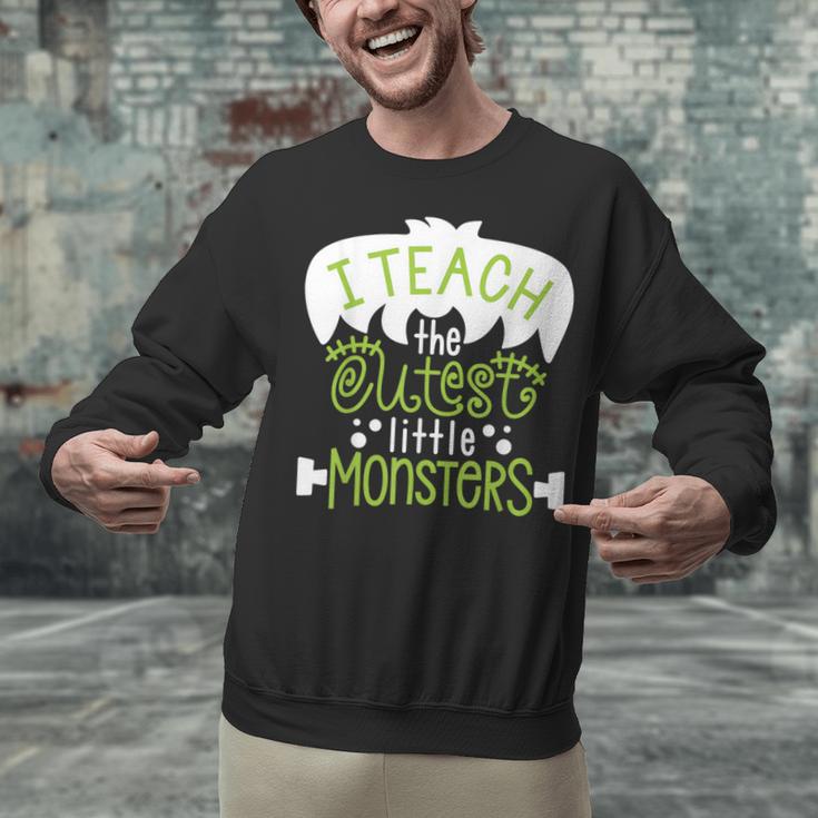 I Teach The Cutest Little Monsters Halloween Teacher Spooky Unisex Sweatshirt, gift for family, gift for coworker I Teach The Cutest Little Monsters Halloween Teacher Spooky Unisex Sweatshirt, gift for family, gift for coworker