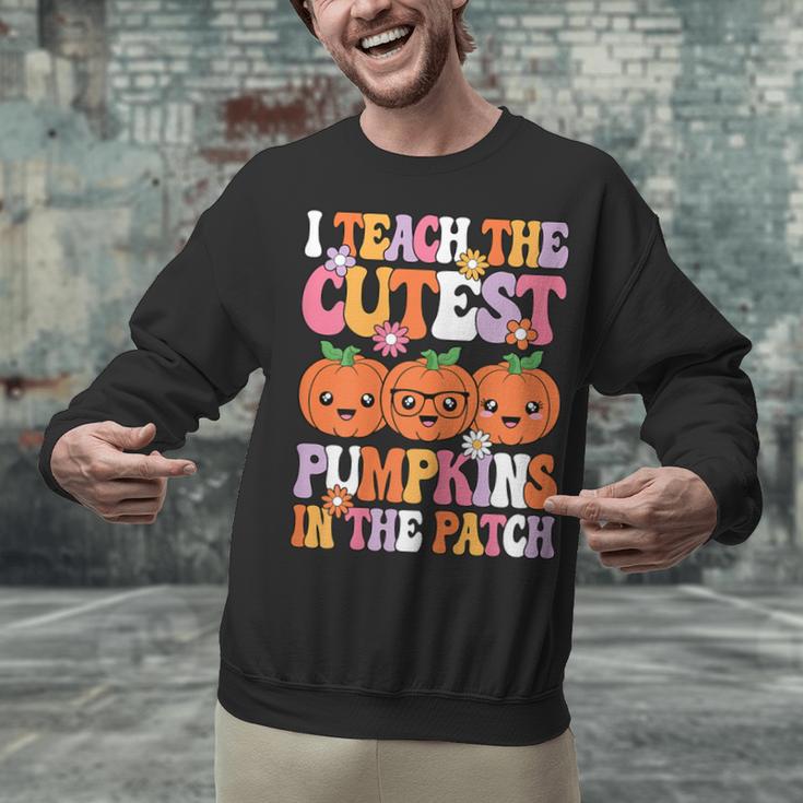I Teach The Cutest Pumpkins Halloween Fall Teacher Women Unisex Sweatshirt, gift for family, gift for coworker I Teach The Cutest Pumpkins Halloween Fall Teacher Women Unisex Sweatshirt, gift for family, gift for coworker