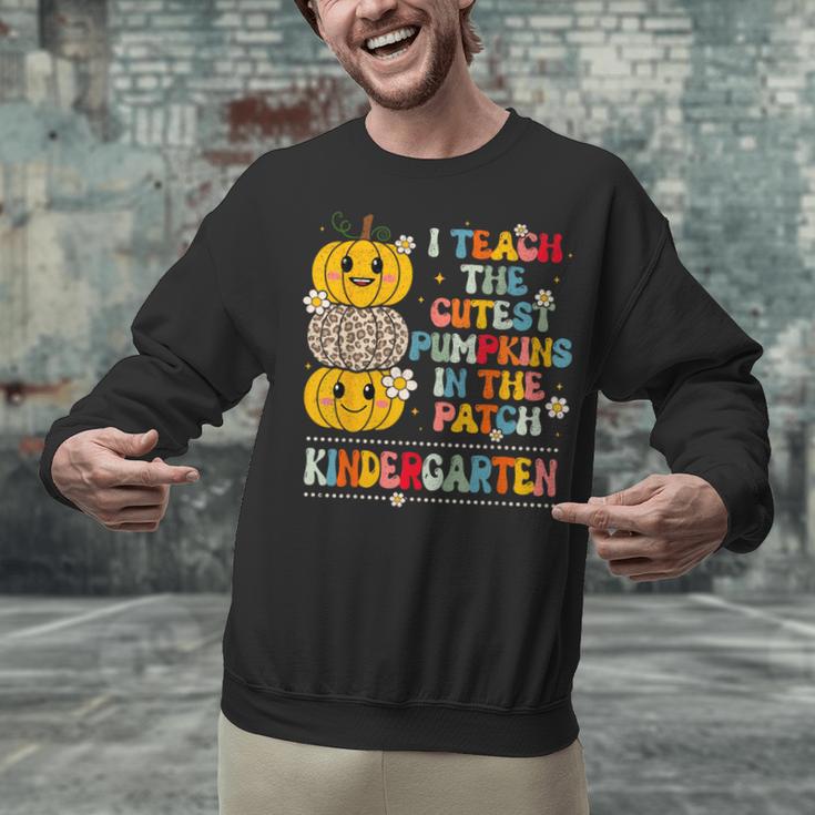 I Teach The Cutest Pumpkins Kindergarten Teacher Halloween Unisex Sweatshirt, gift for family, gift for coworker I Teach The Cutest Pumpkins Kindergarten Teacher Halloween Unisex Sweatshirt, gift for family, gift for coworker