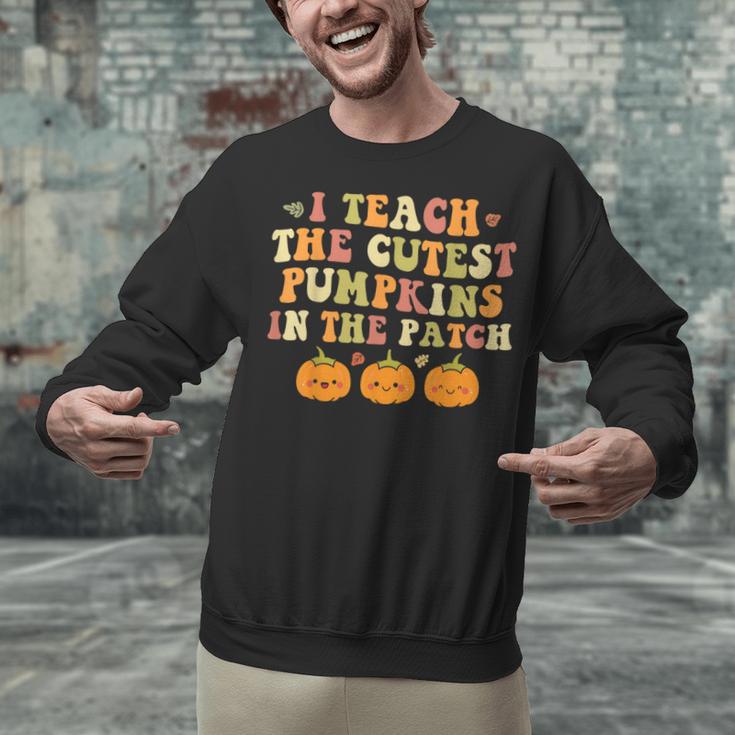 I Teach The Cutest Pumpkins In The Patch Fall Season Teacher Unisex Sweatshirt, gift for family, gift for coworker I Teach The Cutest Pumpkins In The Patch Fall Season Teacher Unisex Sweatshirt, gift for family, gift for coworker