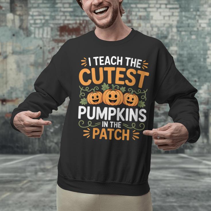 I Teach The Cutest Pumpkins In The Patch Halloween Teacher Unisex Sweatshirt, gift for family, gift for coworker I Teach The Cutest Pumpkins In The Patch Halloween Teacher Unisex Sweatshirt, gift for family, gift for coworker