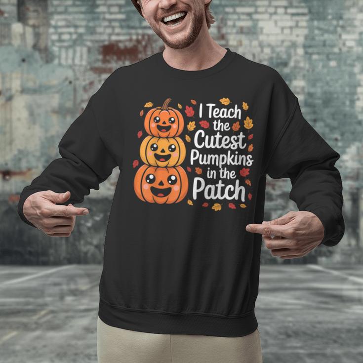 i Teach The Cutest Pumpkins In The Patch Teacher Halloween Unisex Sweatshirt, gift for family, gift for coworker i Teach The Cutest Pumpkins In The Patch Teacher Halloween Unisex Sweatshirt, gift for family, gift for coworker