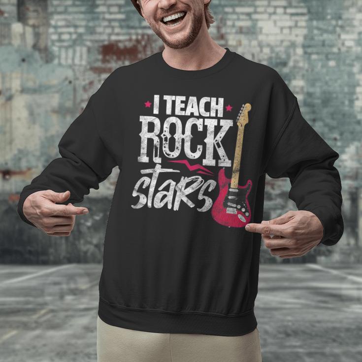 I Teach Rock Stars Music Teacher Guitar Player Unisex Sweatshirt, gift for family, gift for coworker I Teach Rock Stars Music Teacher Guitar Player Unisex Sweatshirt, gift for family, gift for coworker