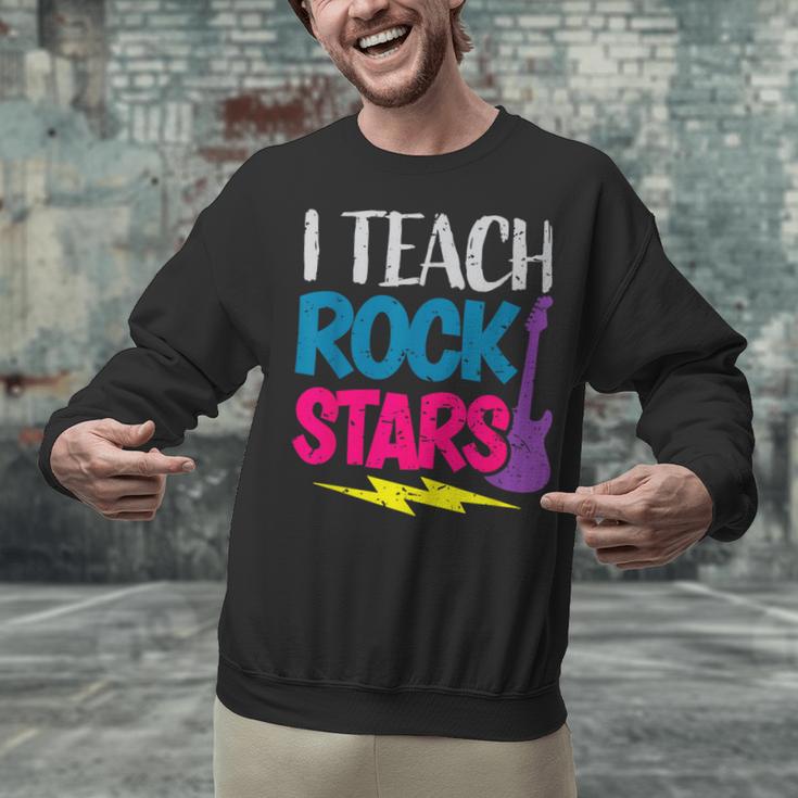 I Teach Rockstars Tee Orchestra Music Teacher Back To School Unisex Sweatshirt, gift for family, gift for coworker I Teach Rockstars Tee Orchestra Music Teacher Back To School Unisex Sweatshirt, gift for family, gift for coworker
