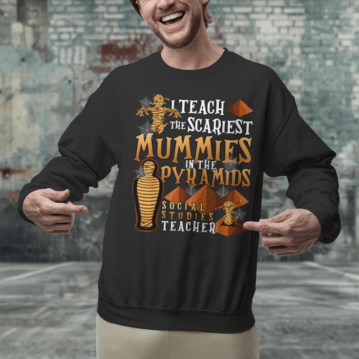 Teach The Scariest Mummies Halloween Social Studies Teacher Men Women Unisex Sweatshirt, gift for family, gift for coworker Teach The Scariest Mummies Halloween Social Studies Teacher Men Women Unisex Sweatshirt, gift for family, gift for coworker