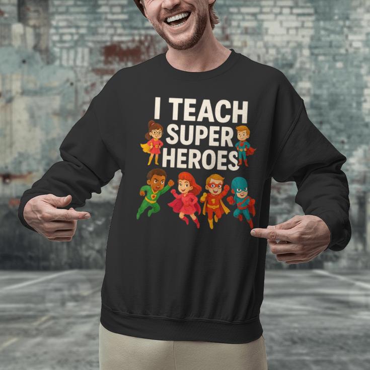 I Teach Super Heroes Teacher Unisex Sweatshirt, Super Teacher Sweatshirts, gift for family, gift for coworker