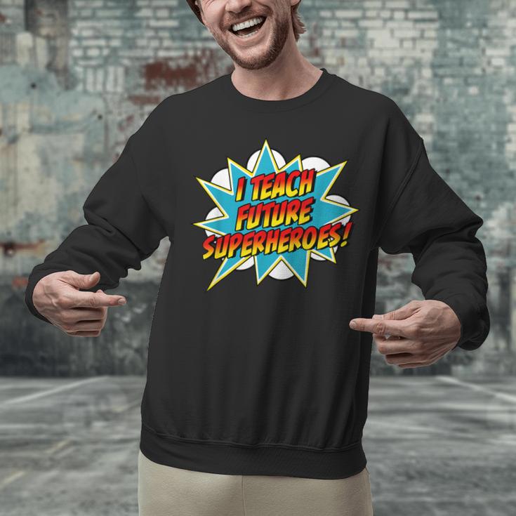 I Teach Superheroes Retro Comic Super Teacher Graphic Unisex Sweatshirt, Super Teacher Sweatshirts, gift for family, gift for coworker I Teach Superheroes Retro Comic Super Teacher Graphic Unisex Sweatshirt, Super Teacher Sweatshirts, gift for family, gift for coworker