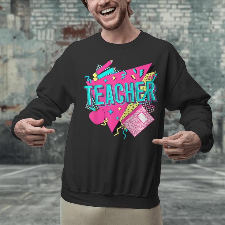 Teacher 90s Retro Colorful Teacher Of The 90s Back To School Unisex Sweatshirt, 90s Teacher Sweatshirts, gift for family, gift for coworker Teacher 90s Retro Colorful Teacher Of The 90s Back To School Unisex Sweatshirt, 90s Teacher Sweatshirts, gift for family, gift for coworker