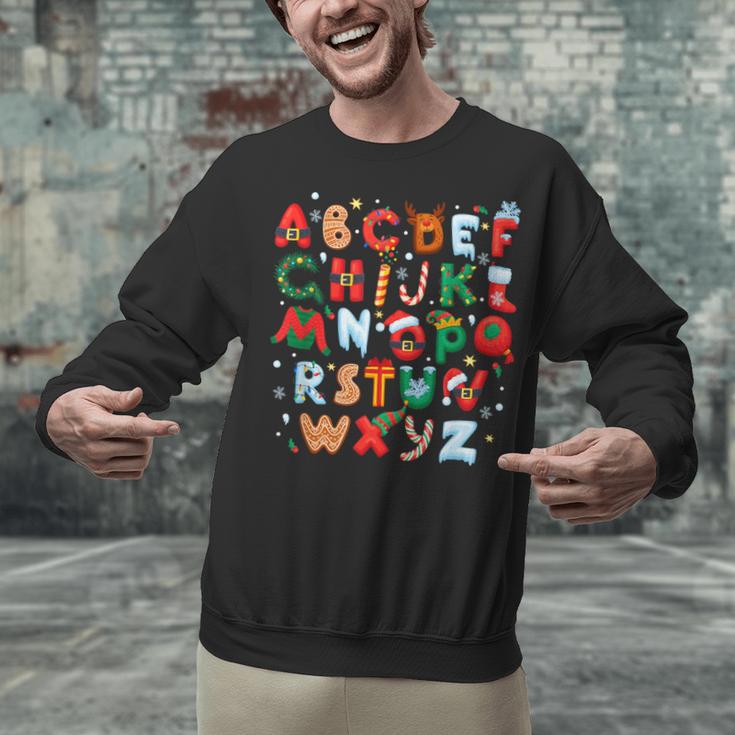 Teacher Christmas Alphabet Back To School Holiday Learning Unisex Sweatshirt, gift for family, gift for coworker Teacher Christmas Alphabet Back To School Holiday Learning Unisex Sweatshirt, gift for family, gift for coworker