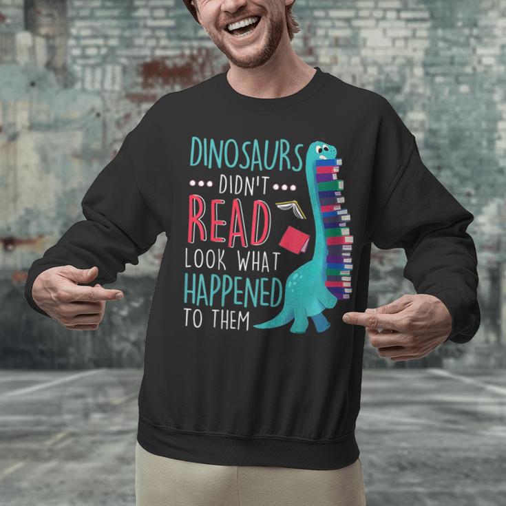 Teacher Dinosaurs Didnt Read Look What Happened Book Reading Unisex Sweatshirt, gift for family, gift for coworker Teacher Dinosaurs Didnt Read Look What Happened Book Reading Unisex Sweatshirt, gift for family, gift for coworker