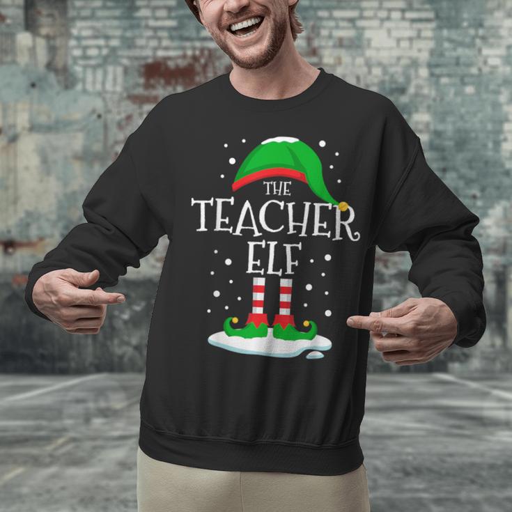 The Teacher Elf Christmas Family Matching Xmas Group For Men Women Unisex Sweatshirt, gift for family, gift for coworker The Teacher Elf Christmas Family Matching Xmas Group For Men Women Unisex Sweatshirt, gift for family, gift for coworker