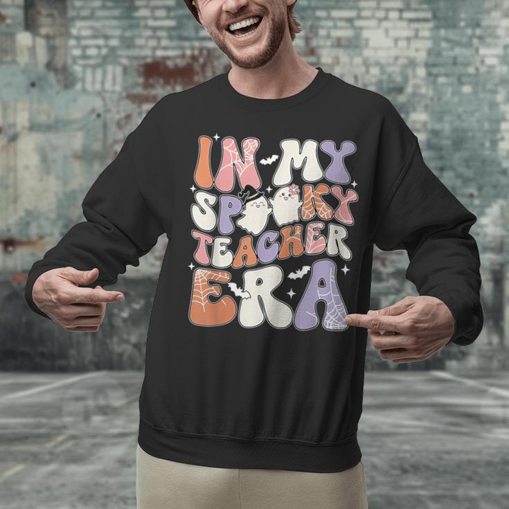 Teacher Halloween In My Spooky Teacher Era Retro Groovy Unisex Sweatshirt, Groovy Teacher Sweatshirts, gift for family, gift for coworker Teacher Halloween In My Spooky Teacher Era Retro Groovy Unisex Sweatshirt, Groovy Teacher Sweatshirts, gift for family, gift for coworker