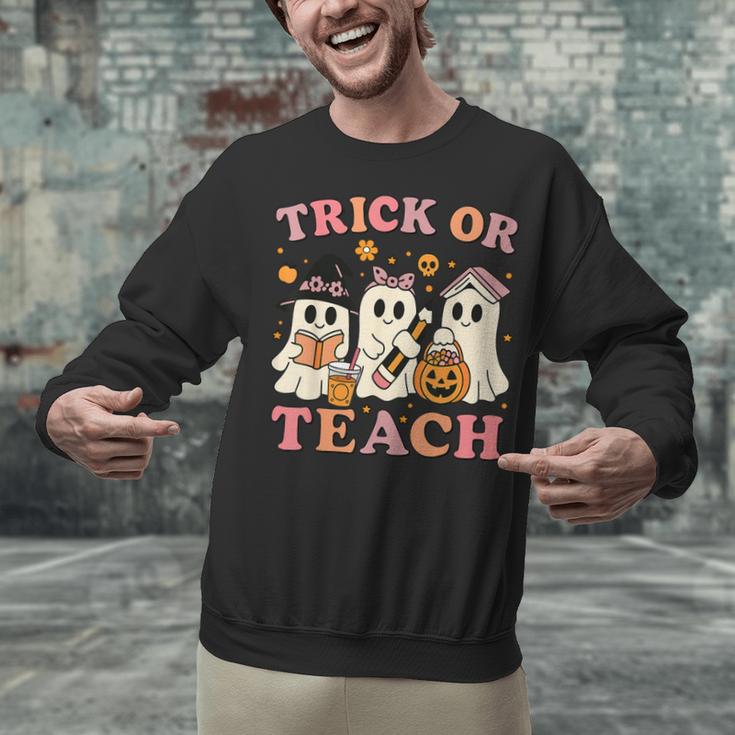 Teacher Halloween Trick Or Teach Cute Ghost Coffee Pumpkins Unisex Sweatshirt, gift for family, gift for coworker Teacher Halloween Trick Or Teach Cute Ghost Coffee Pumpkins Unisex Sweatshirt, gift for family, gift for coworker