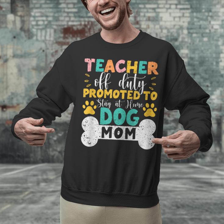 Teacher Off Duty Promoted To Stay At Home Dog Mom Teachers Unisex Sweatshirt, gift for family, gift for coworker
