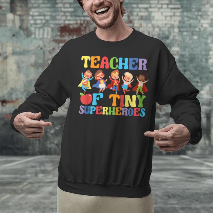 Teacher Of Tiny Superheroes Teach 100th Day Of School Unisex Sweatshirt, gift for family, gift for coworker Teacher Of Tiny Superheroes Teach 100th Day Of School Unisex Sweatshirt, gift for family, gift for coworker