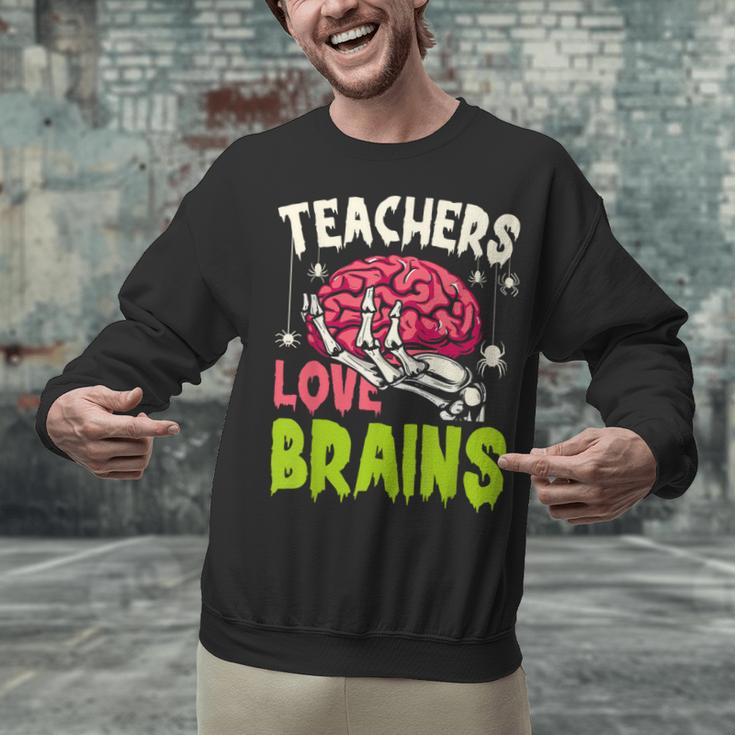 Teachers Love Brains Skeleton Halloween Teacher Funny Unisex Sweatshirt, gift for family, gift for coworker Teachers Love Brains Skeleton Halloween Teacher Funny Unisex Sweatshirt, gift for family, gift for coworker