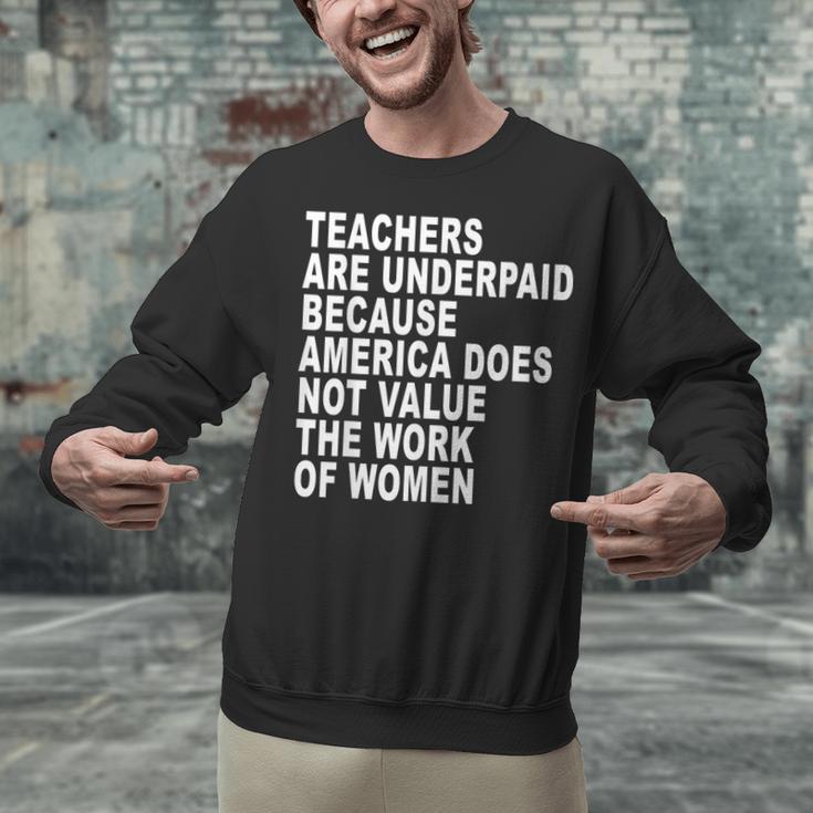 Teachers Are Underpaid Because America Does Not Value Men Women Unisex Sweatshirt, gift for family, gift for coworker Teachers Are Underpaid Because America Does Not Value Men Women Unisex Sweatshirt, gift for family, gift for coworker