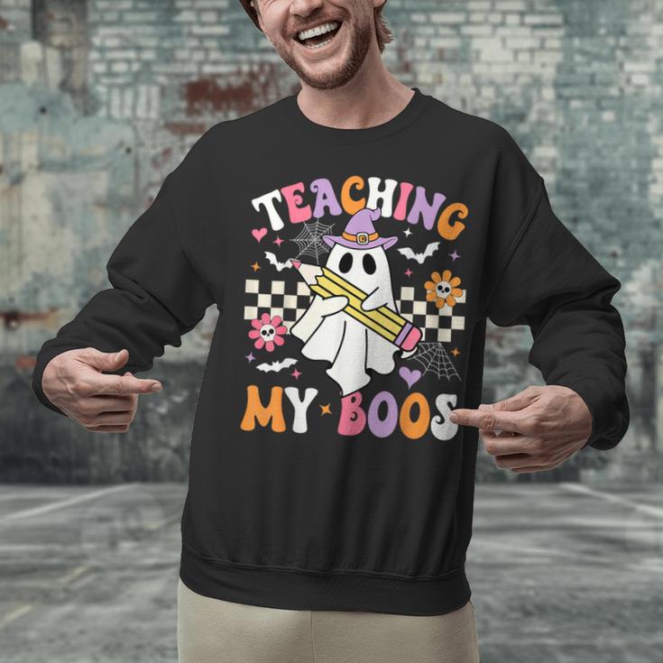 Teaching My Boos Ghost Teacher Cute Groovy Halloween Teacher Unisex Sweatshirt, Groovy Teacher Sweatshirts, gift for family, gift for coworker