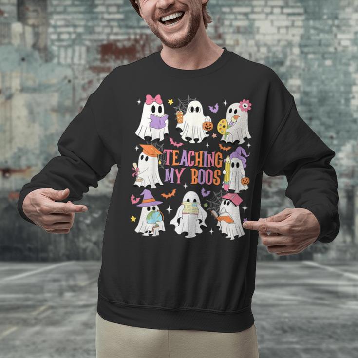 Teaching My Boos Teacher Cute Ghost Groovy Teacher Halloween Unisex Sweatshirt, Groovy Teacher Sweatshirts, gift for family, gift for coworker Teaching My Boos Teacher Cute Ghost Groovy Teacher Halloween Unisex Sweatshirt, Groovy Teacher Sweatshirts, gift for family, gift for coworker