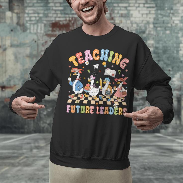 Teaching Future Leaders Teacher Back To School Cute Goose Unisex Sweatshirt, Future Teacher Sweatshirts, gift for family, gift for coworker Teaching Future Leaders Teacher Back To School Cute Goose Unisex Sweatshirt, Future Teacher Sweatshirts, gift for family, gift for coworker