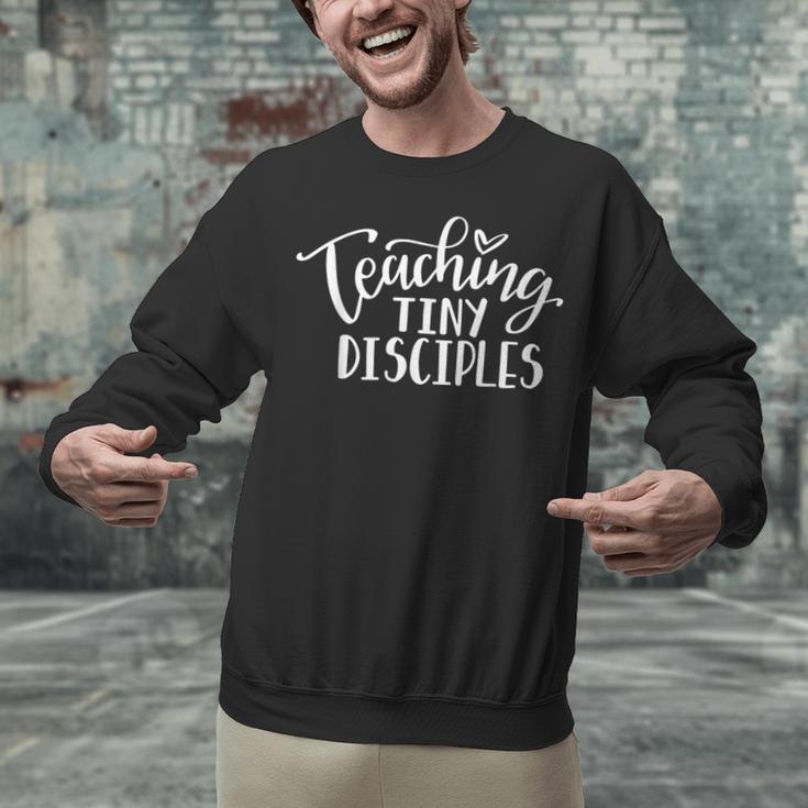 Teaching Tiny Disciples Christian Teacher Unisex Sweatshirt, gift for family, gift for coworker Teaching Tiny Disciples Christian Teacher Unisex Sweatshirt, gift for family, gift for coworker